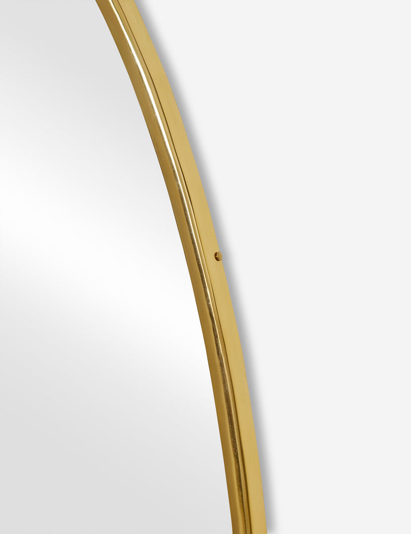 #size::large | The gold curved frame on the large puddle mirror
