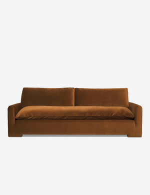Rupert cognac velvet sofa with an elevated frame and plush cushions by Sarah Sherman Samuel