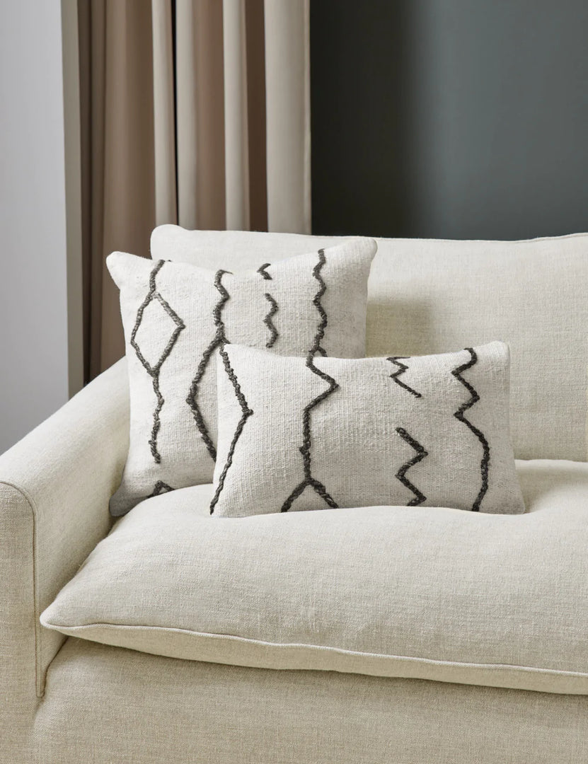 #color::black-&-natural #style::lumbar | The Moroccan black and natural beni ourain inspired square and lumbar flat weave pillow by Sarah Sherman Samuel sit together on a cream linen sofa