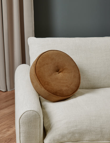 #color::amber | Velvet Disc amber Pillow by Sarah Sherman Samuel sits on natural linen accent chair