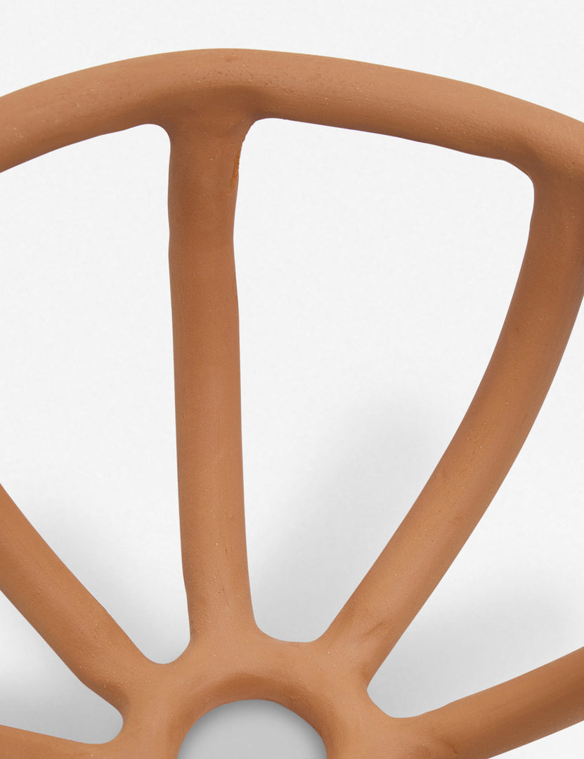 #color::terracotta | Close-up of the center and side of the Prong terracotta ceramic centerpiece bowl by SIN