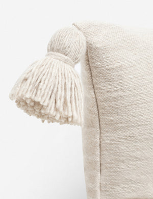Close-up of the pom pom on the corner of the Sami natural lumbar pillow