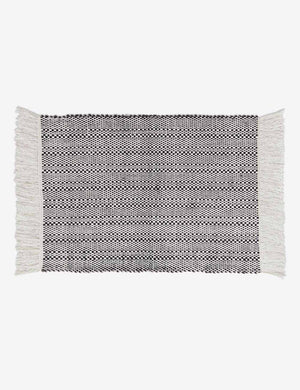 Saskia handwoven high contrast black-and-white patterned mat with thick fringe