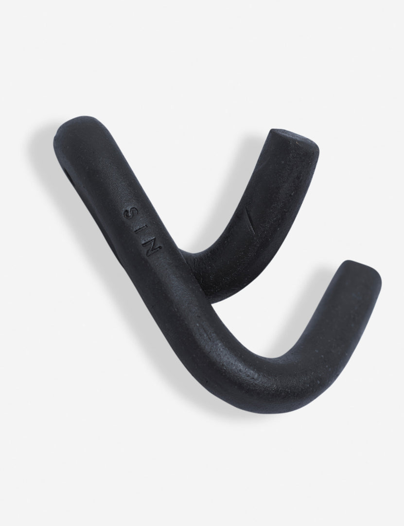 #color::black | Angled view of the Black Leggy Crossed Wall Hook by SIN Ceramics