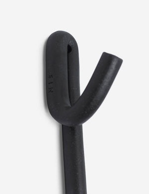Close-up of the first hook on the Black Leggy Long Wall Hook by SIN Ceramics