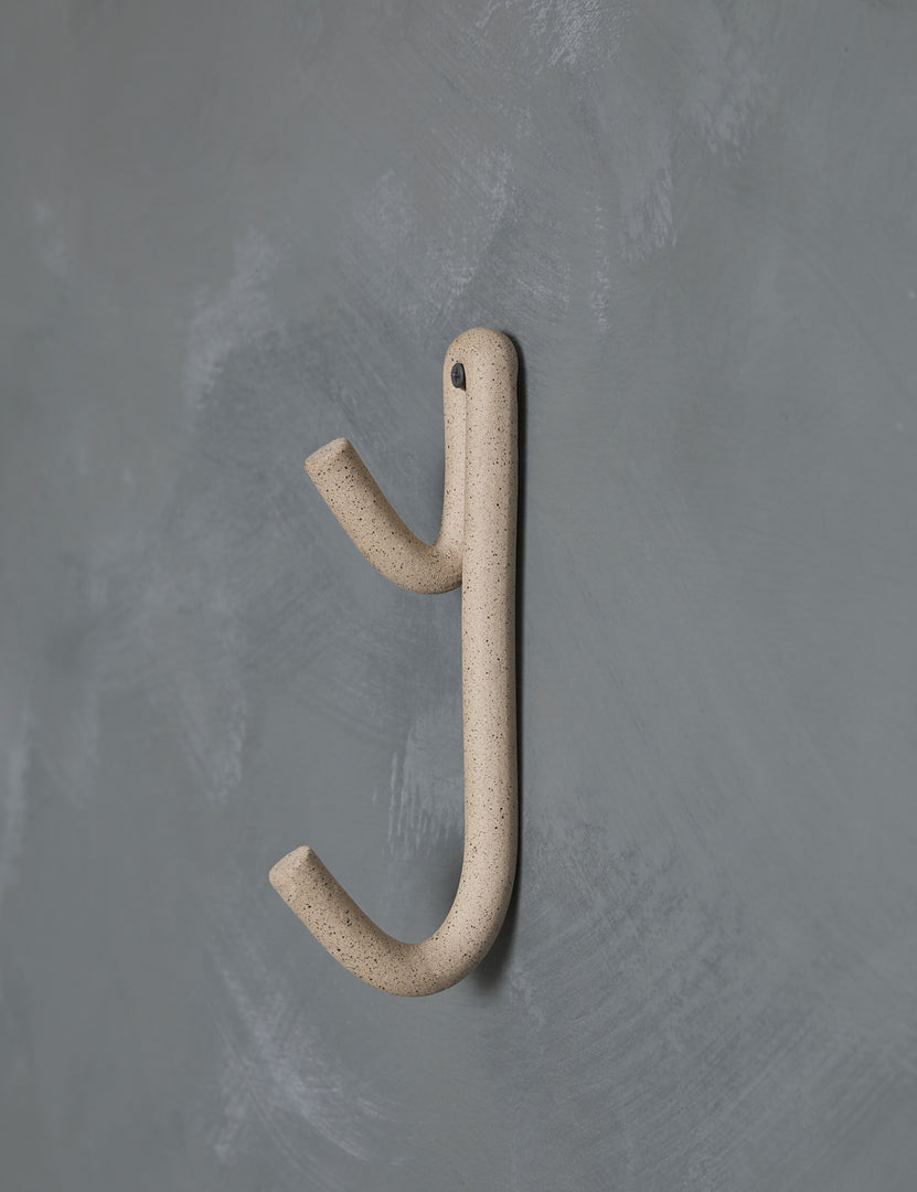 #color::speckled | Cream speckled Leggy Long Wall Hook by SIN Ceramics hanging on a gray wall