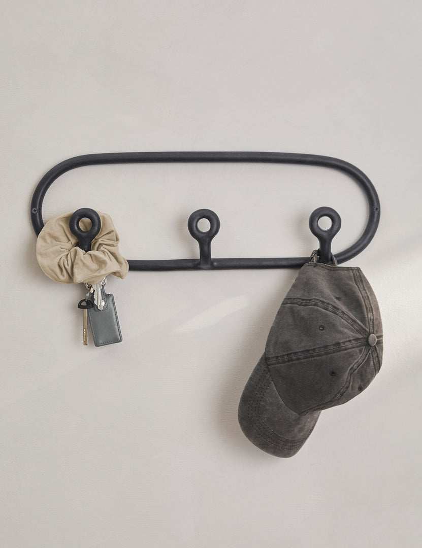 #color::black | Black Trio Stoneware Coat Rack by SIN Ceramics with a scrunchie, keys, and hat hanging from it