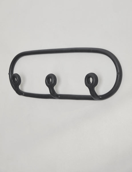 #color::black | Angled view of the Black Trio Stoneware Coat Rack by SIN Ceramics
