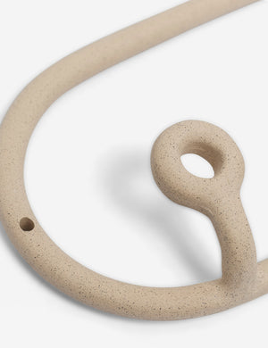 Close-up of one of the hangers on the cream speckled Trio Stoneware Coat Rack by SIN Ceramics