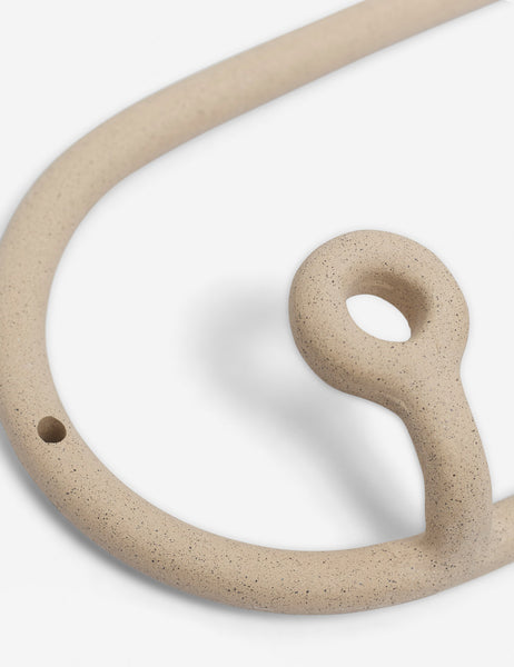 #color::speckled | Close-up of one of the hangers on the cream speckled Trio Stoneware Coat Rack by SIN Ceramics