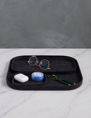 The Tray Trio in carbon black (Set of 3) by SortJoy with glasses, an airpods case, lip balm, and pens