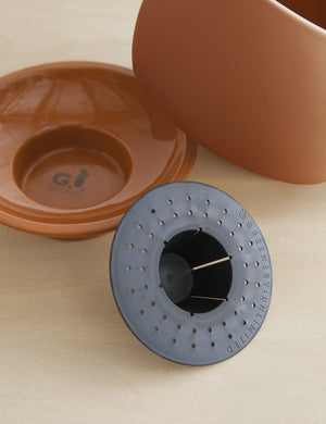 Sutton Ceramic Self-Watering Planter with the bottom piece, top piece, and self-watering mechanism taken apart