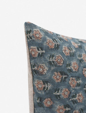 Corner-shot of the Tamra blue and pink lumbar pillow with floral patterns