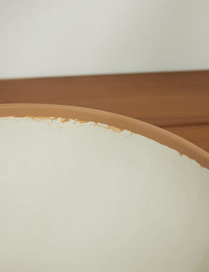 Close-up of the terracotta rim on the Tara Melamine and bamboo white Serving Bowl