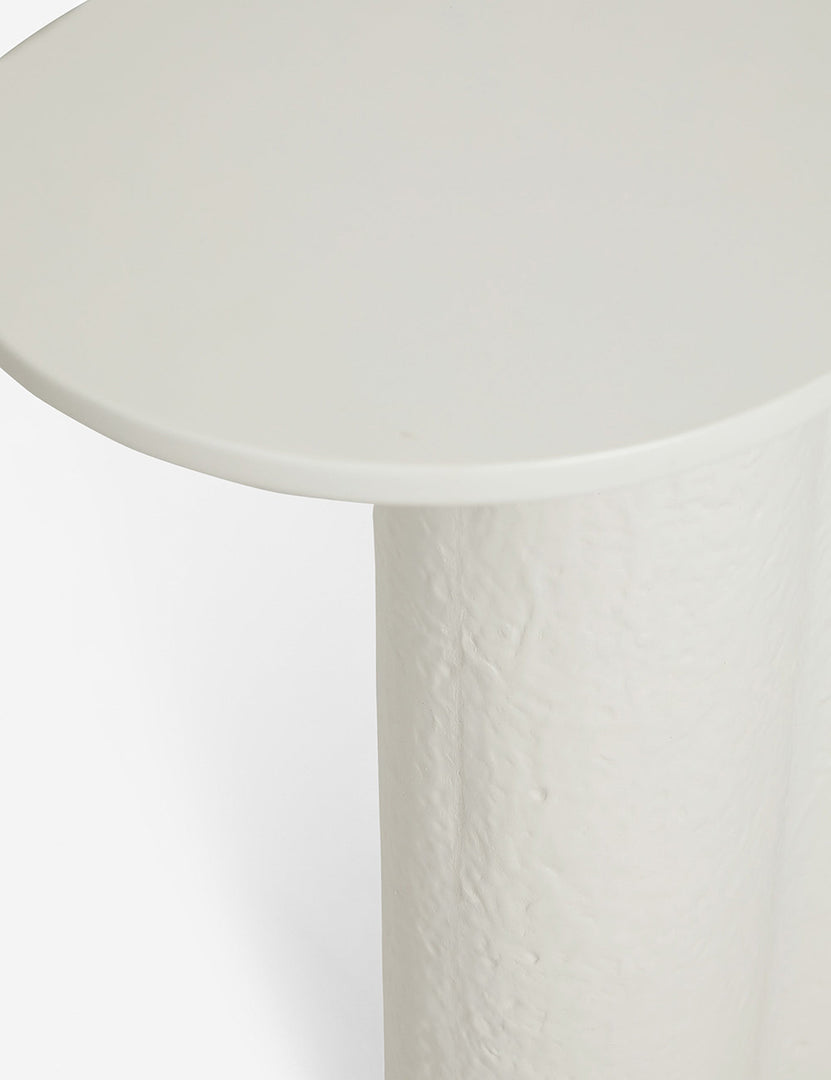| Close-up of the rim and leg of the Tatia White Console Table