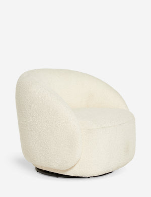 Angled rear view of the tauri cream boucle swivel chair