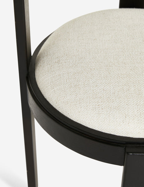 #color::black | Close up of the ivory cushion and black frame on the Tobie Dining Chair (Set of 2)