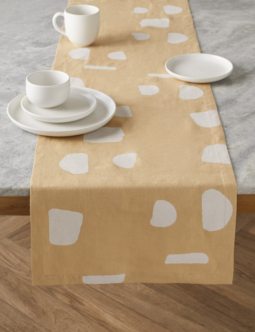 #color::salt | The Pacifica salt white Dinnerware 5-Piece Place Setting by Casafina sits atop a yellow and white patterned table running atop a stone table