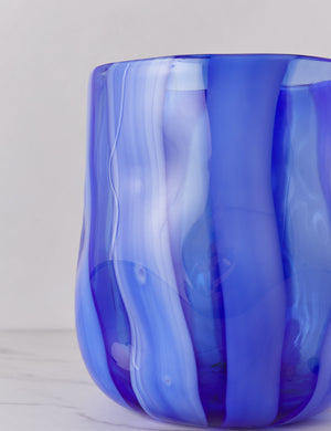Close up of the Umi glass vase with striated wave-like vertical blue lines