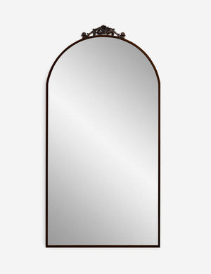 Tulca oil rubbed bronze curved standing mirror with flat bottom edge and traditional scroll detailing.