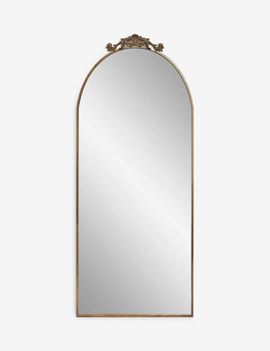 Tulca narrow brass floor mirror with a flat bottom edge and traditional scroll detailing