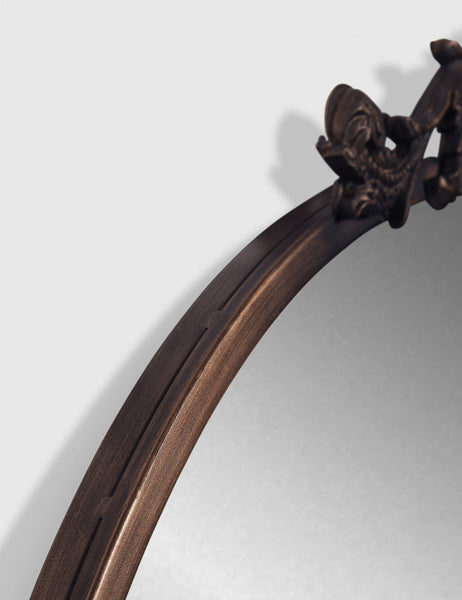 #color::oil-rubbed-bronze | The oil rubbed bronze frame on the tulca round mirror