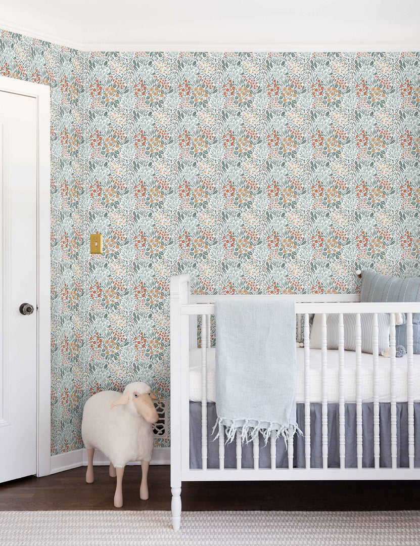 #color::dark | Dark-toned Floral Field Wallpaper by Rylee + Cru is in a nursery with a toy lamb and a white wooden crib
