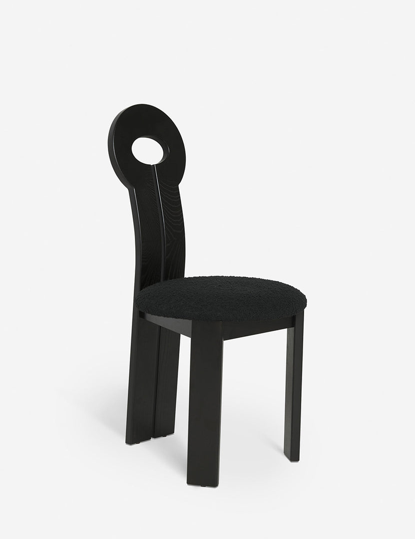 #color::black | Angled view of the Whit black wood sculptural dining chair by sarah sherman samuel