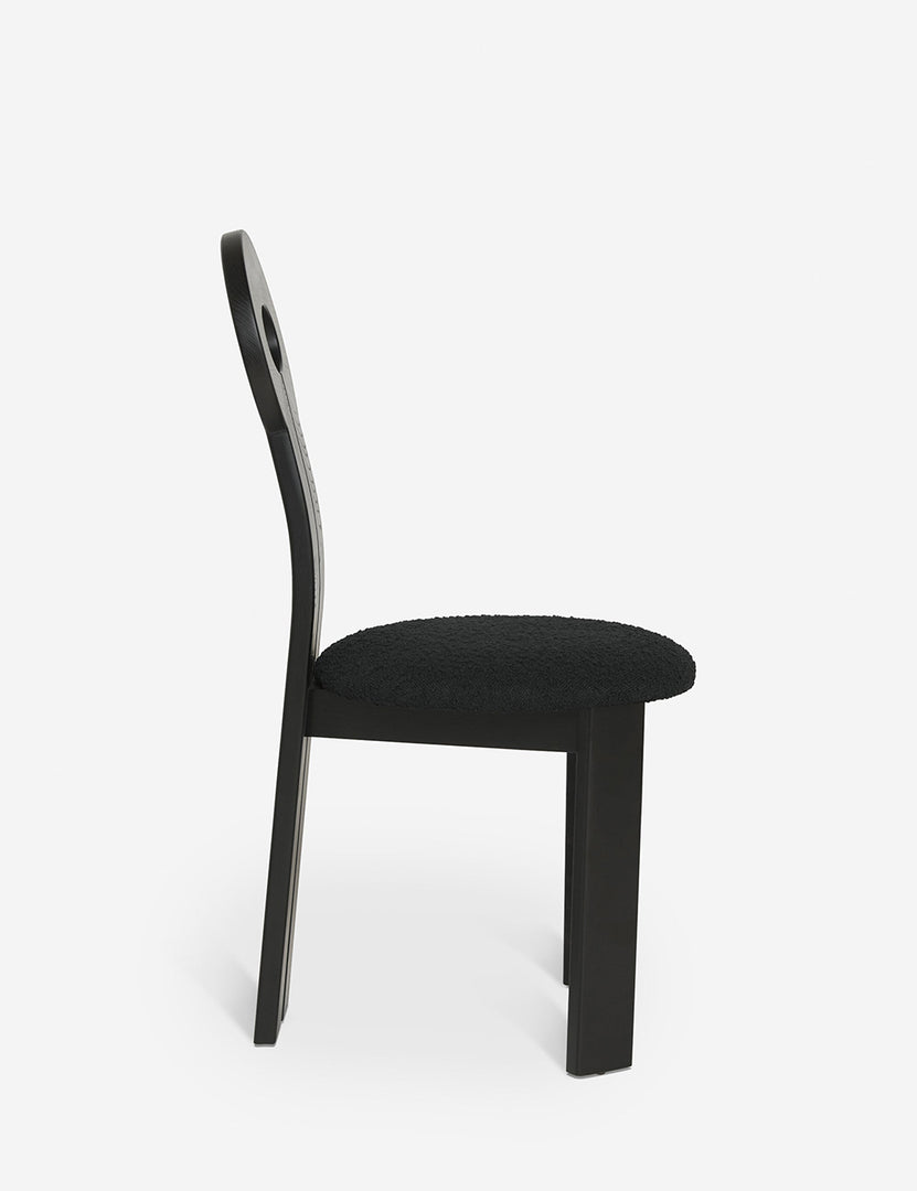 #color::black | Side view of the Whit black wood sculptural dining chair by sarah sherman samuel
