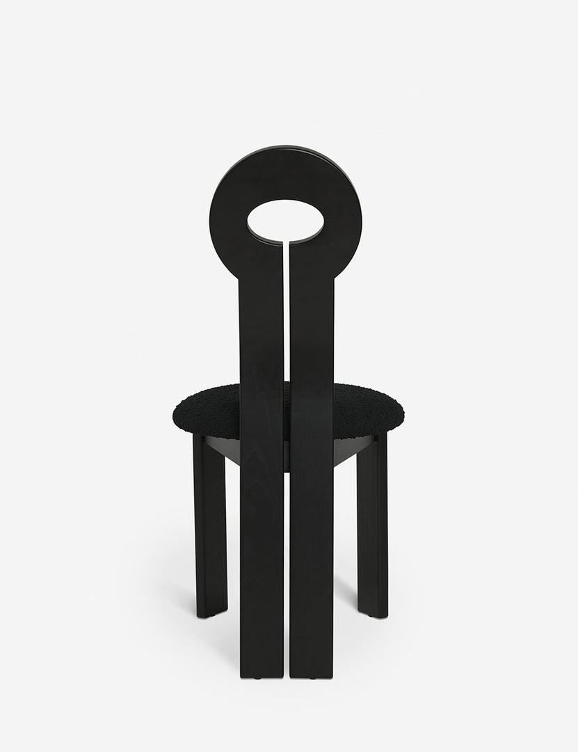 #color::black | Rear view of the Whit black wood sculptural dining chair by sarah sherman samuel