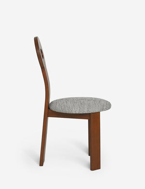Side view of the Whit honey wood sculptural dining chair by sarah sherman samuel