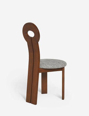 Angled rear view of the Whit honey wood sculptural dining chair by sarah sherman samuel