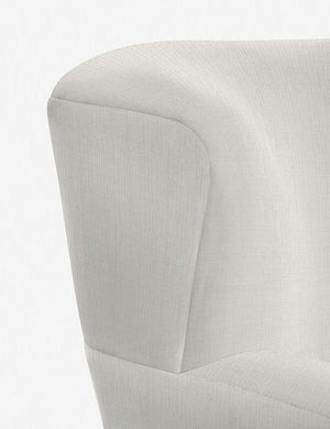 The stitching on the winged back of the Avery ivory linen accent chair