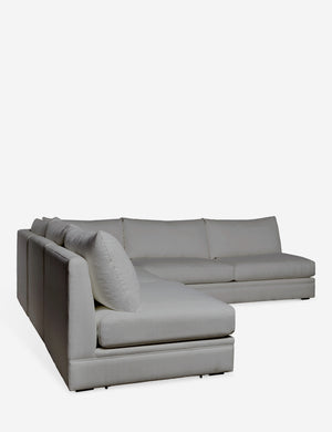 Angled view of the 120 inch width Winona gray performance fabric armless corner sectional sofa