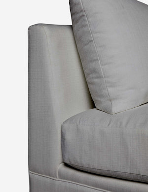 Close-up of the side of the Winona Gray Performance Fabric armless sofa