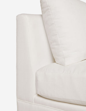 Close-up of the side of the Winona Ivory Linen armless sofa