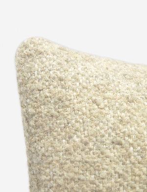 Corner-shot of the manon linen oatmeal cream square boucle pillow