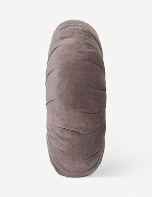 Side view of the Monroe warm gray velvet round pillow