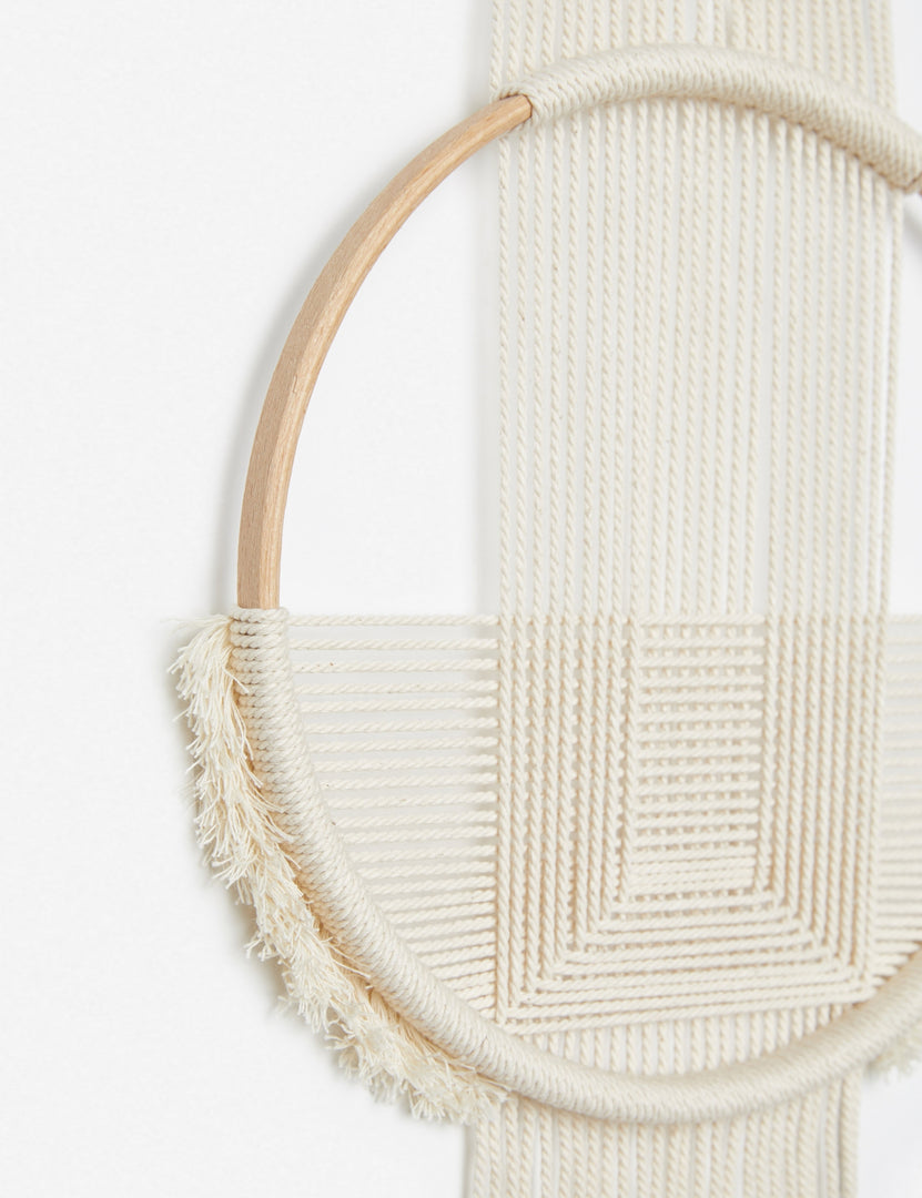 | Close-up of the woven details on the Studio Nom Zanele White handmade tasseled Wall Hanging