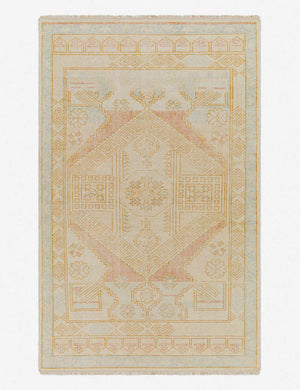 Alexa yellow hand-knotted rug featuring a traditional medallion design and a short fringe