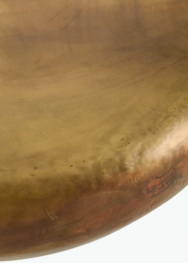 | Close-up of the surface of the Arteriors bates round metallic coffee table