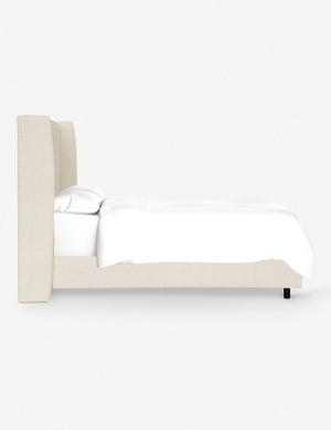 Side view of Adara cream sherpa upholstered bed.