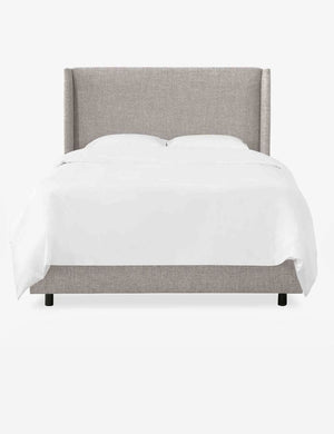 Adara light gray linen upholstered bed.