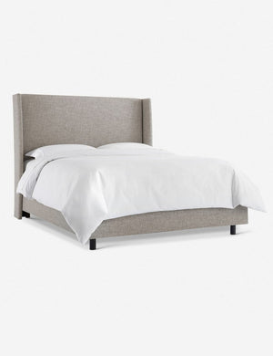 Angled view of Adara light gray linen upholstered bed.