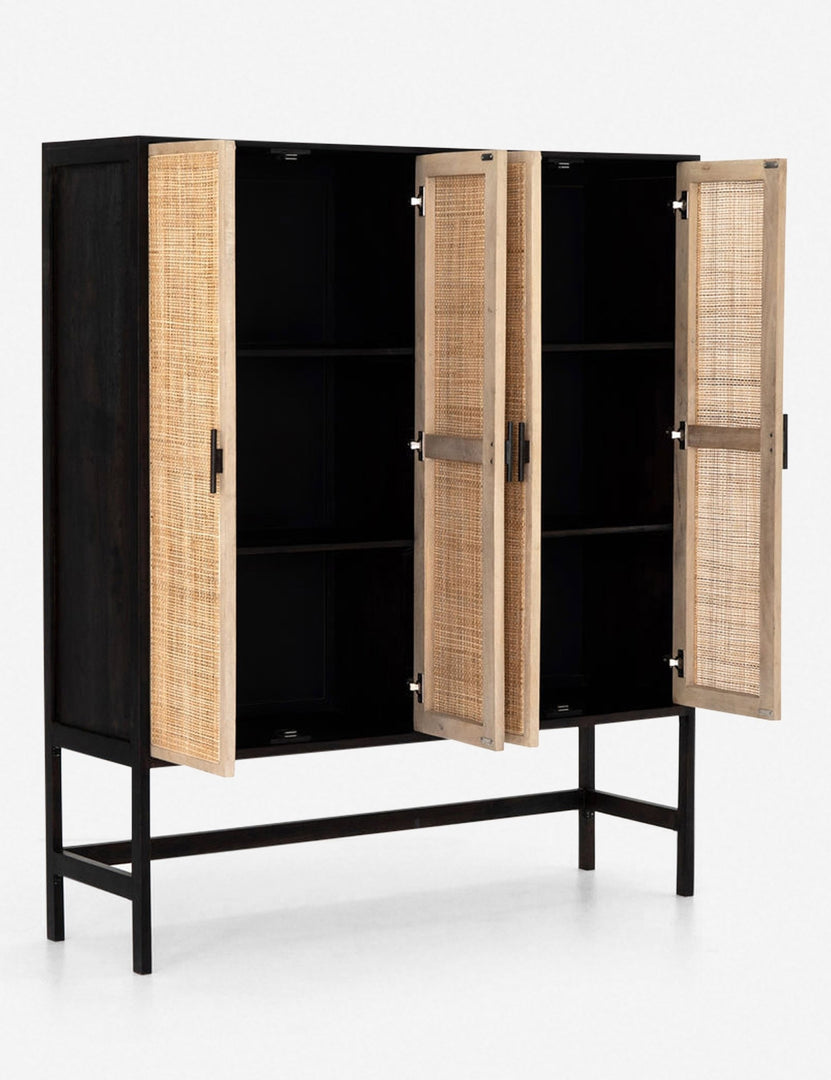 #color::black | Angled view of the Hannah black mango wood cabinet with cane doors with all four doors open revealing the inner shelving
