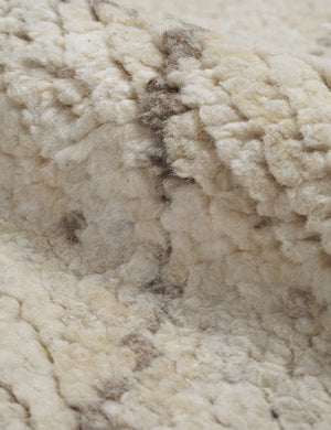 Close-up of the undyed, natural wool on the Afella rug