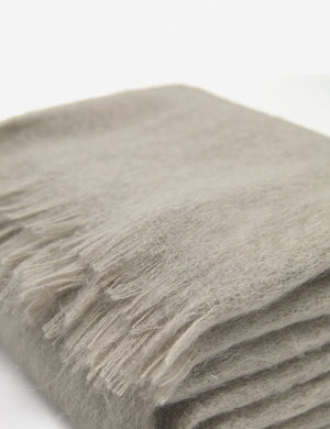 Close-up of the Aimee mohair warm gray wool throw blanket with fringe ends