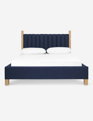 Ambleside dark blue velvet upholstered bed with a wood-post bed frame and a headboard with vertical channeling by Ginny Macdonald