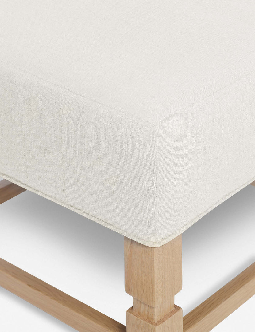 #color::oyster | Close-up of the corner on the cushion of the Ambleside Oyster white ottoman
