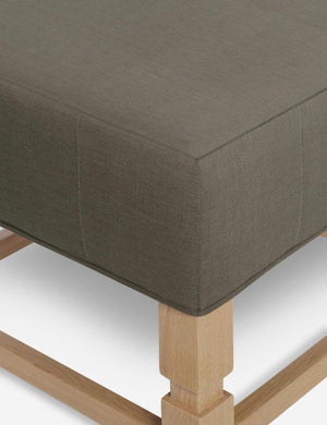 Close-up of the corner on the cushion of the Ambleside Loden gray linen ottoman